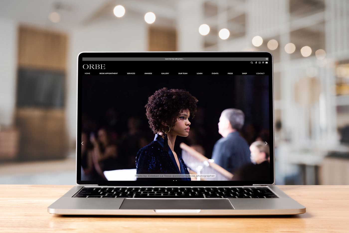 ORBE Hair website - showing on laptop in a salon